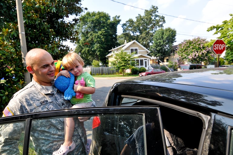 army dad picking up baby from child care