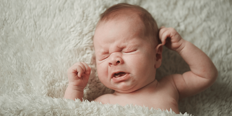 cute-little-sneezing-baby-at-home-blog